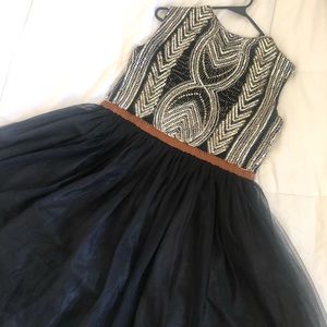 Knee length black beaded homecoming dress